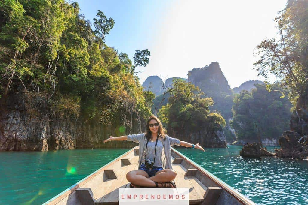 Photo of Woman Sitting on Boat Spreading Her Arms