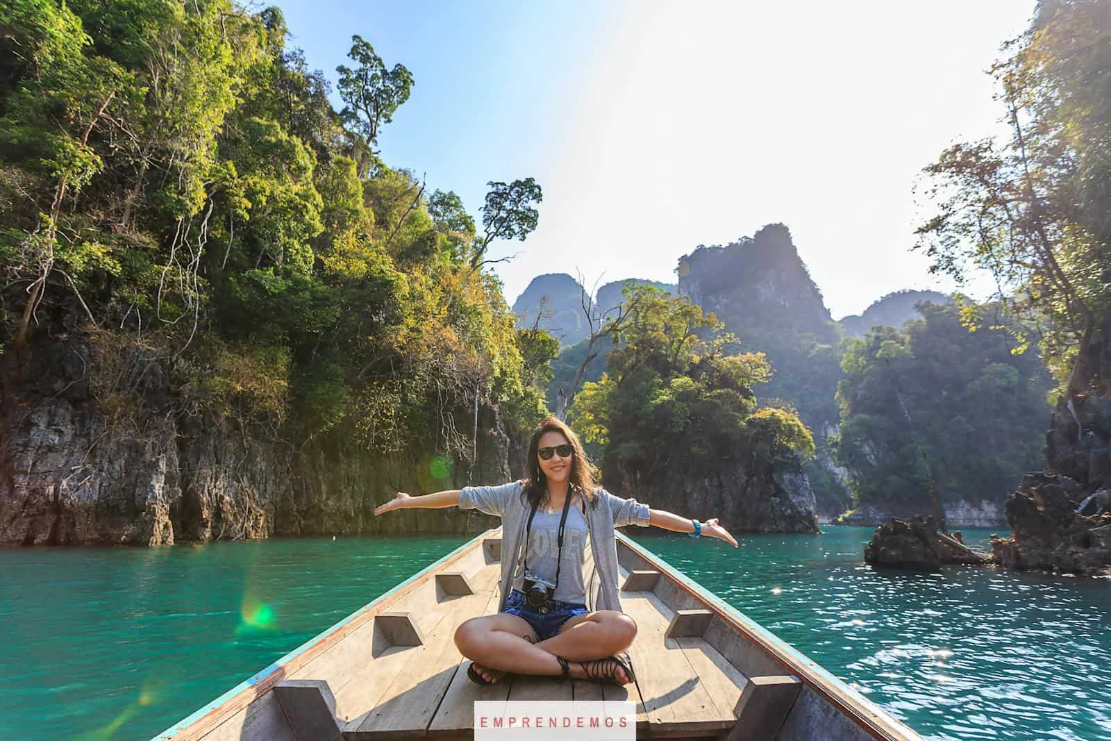 Photo of Woman Sitting on Boat Spreading Her Arms