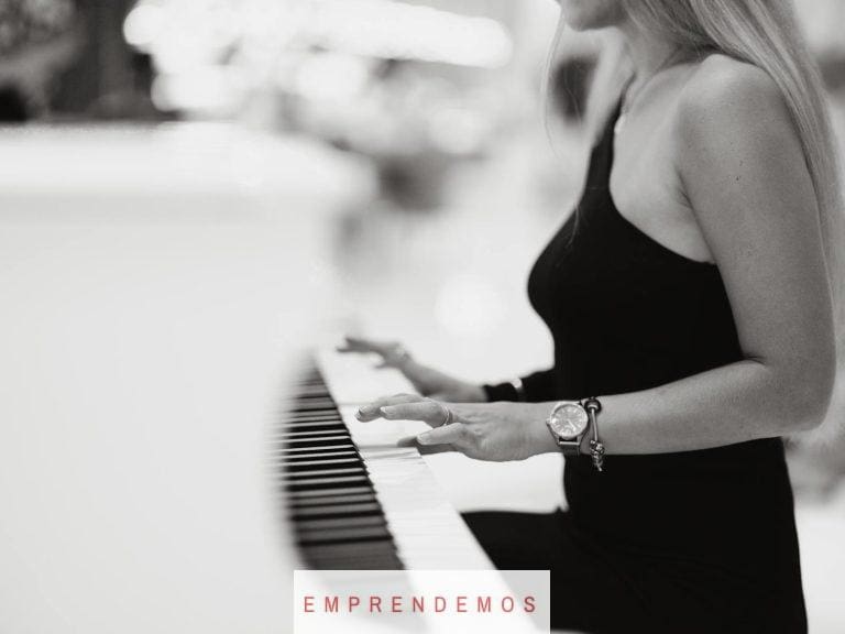 a woman playing the piano