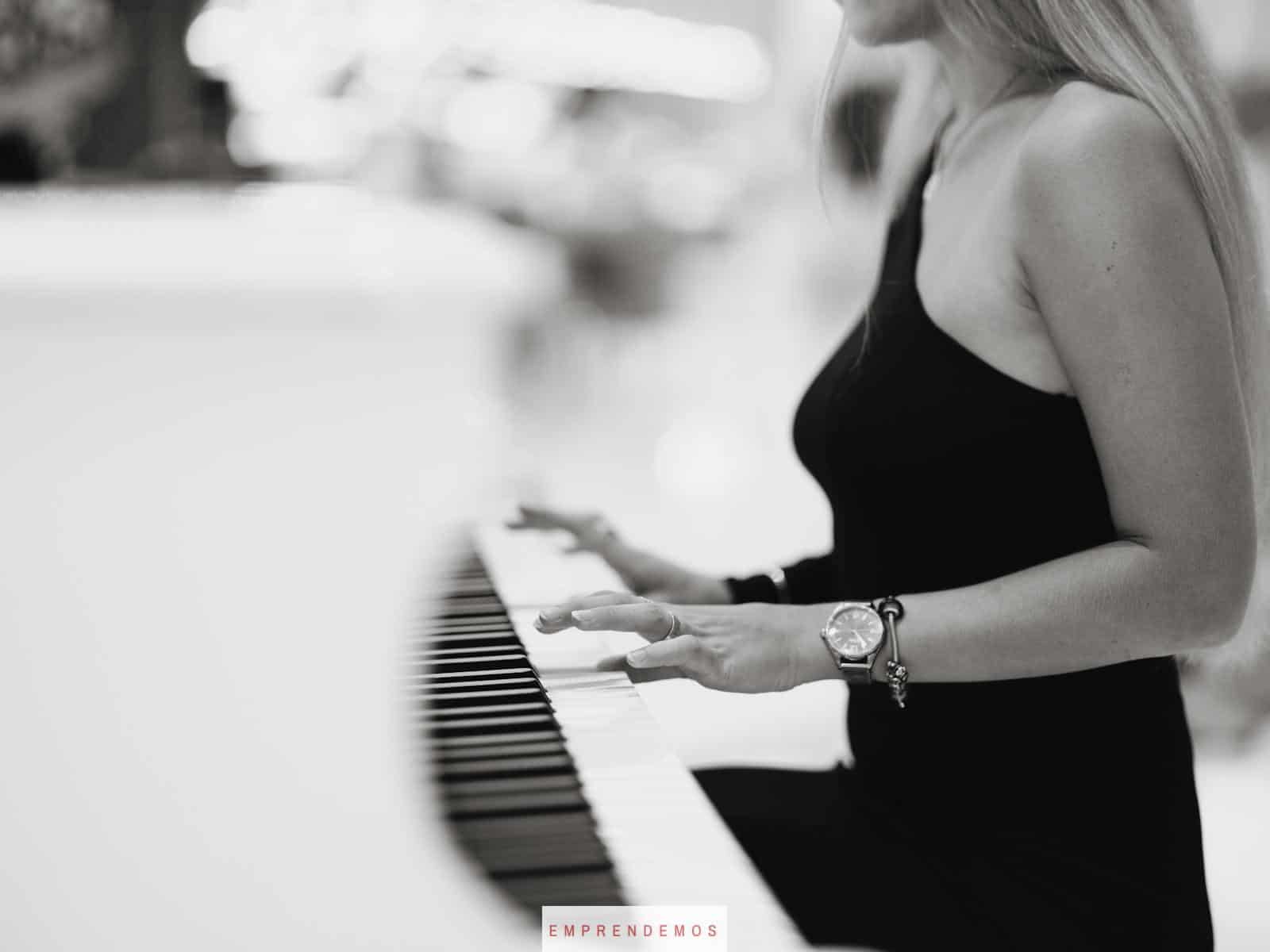 a woman playing the piano