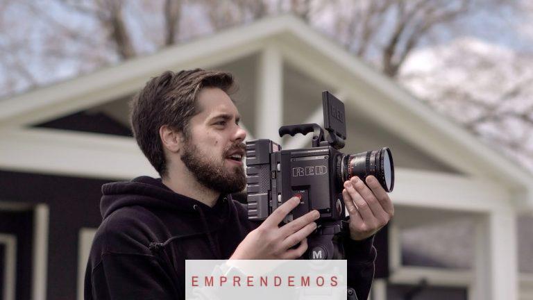 Man in Black Hoodie Jacket Holding Black DSLR Camera