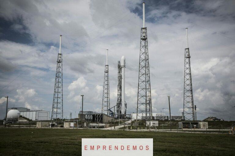 Industrial rocket launch pad with tall towers under a cloudy sky, perfect for technology and energy themes.