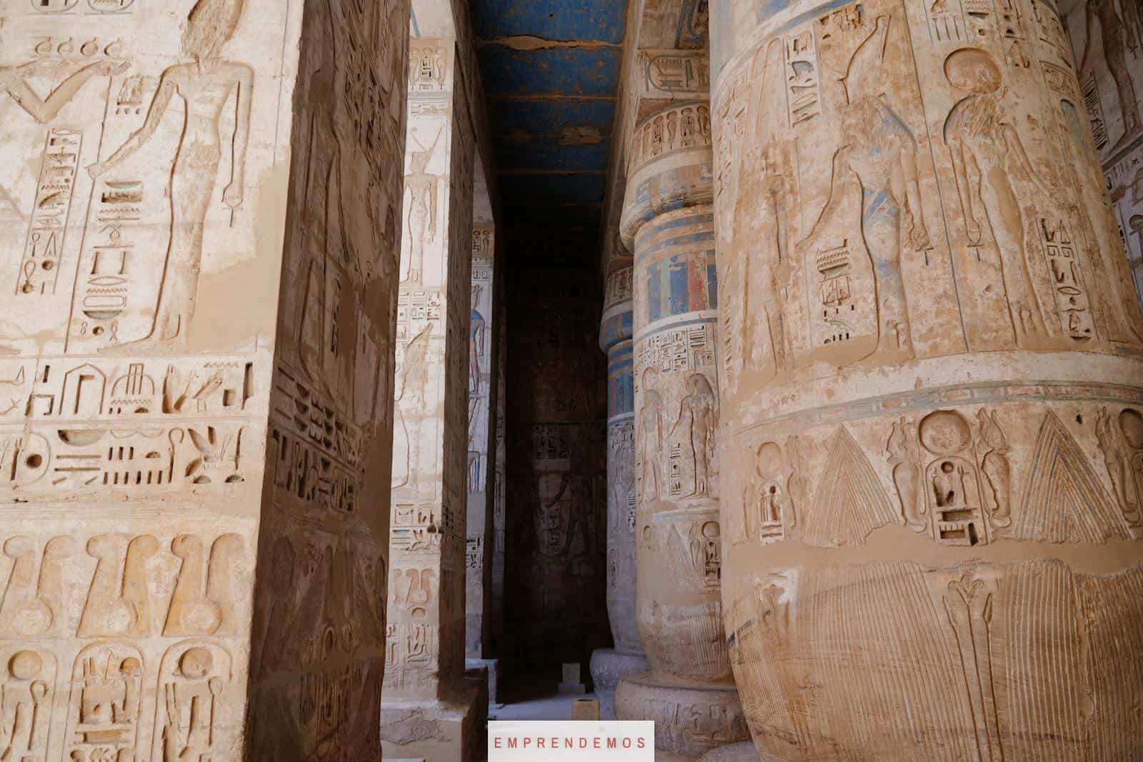 Detailed view of ancient hieroglyphs on temple columns in Luxor, Egypt.