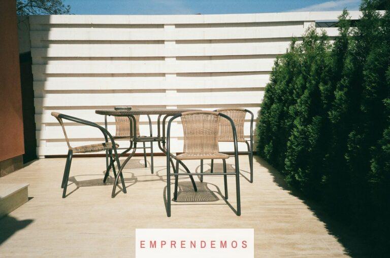 black metal framed white wooden table and chairs