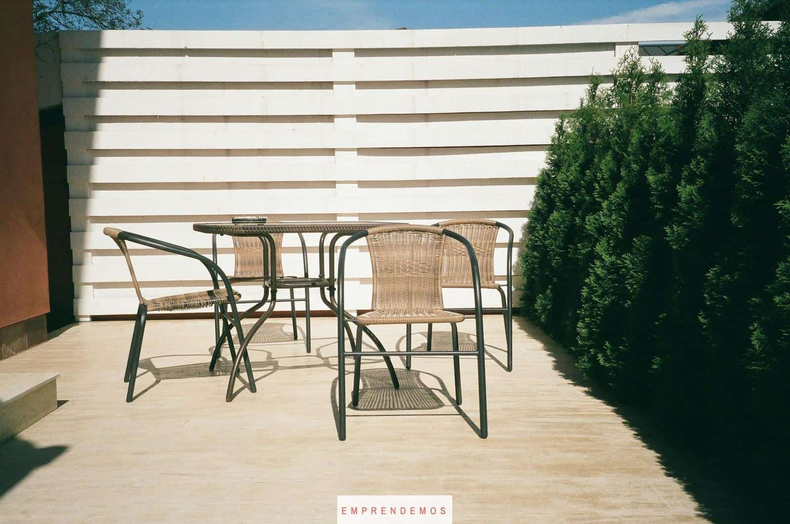 black metal framed white wooden table and chairs