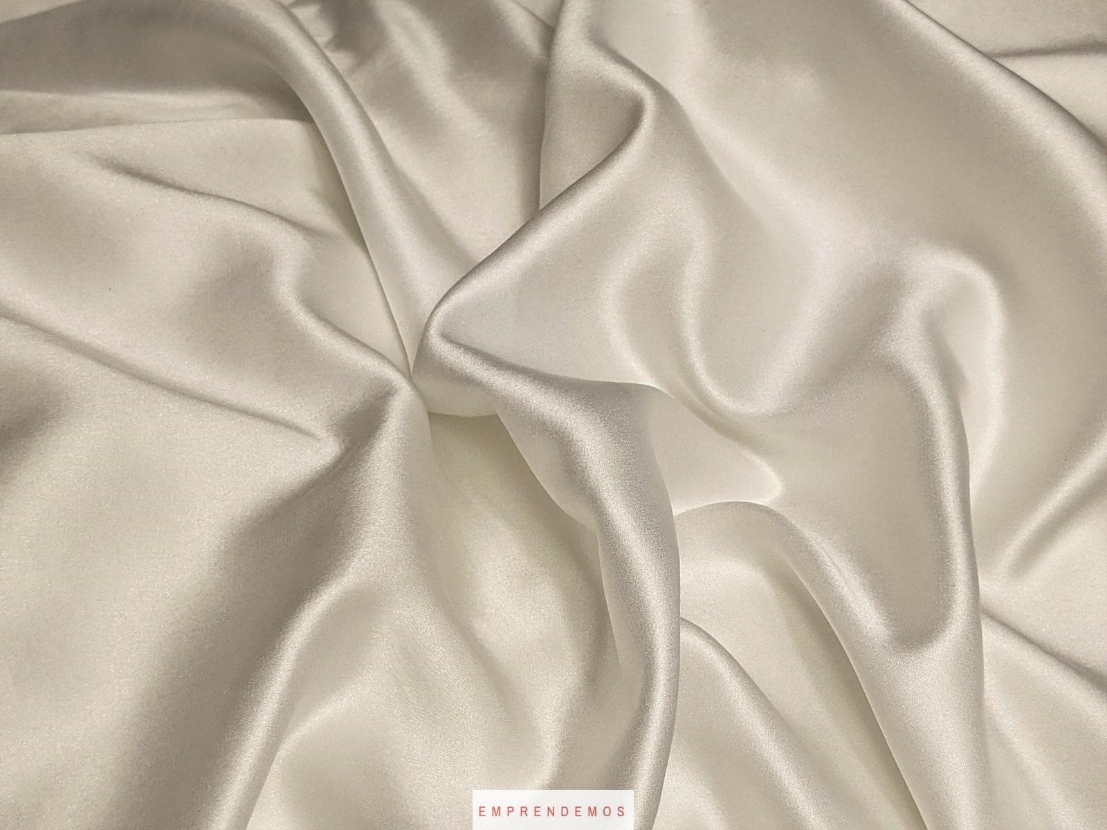white textile on brown wooden table