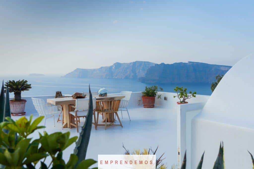 brown wooden table and chairs on white concrete floor